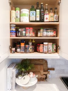 an organized pantry with spices and other items