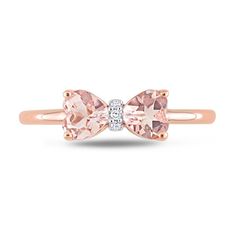 Express your sweet personality and feminine style with this cute heart-shaped pink morganite and diamond accent bow ring in rose gold. Fashioned in precious 10K rose gold This look glistens with a pair of mirrored 5.0mm heart-shaped soft-pink morganites. The diamond-accented center adds a hint of shimmer to this bow design. Bow Diamond Ring, Pink Bow Jewelry For Anniversary, Bow Engagement Ring, Sweet Personality, Gold Book, Morganite Diamond, Bow Ring, Peoples Jewellers, Pink Morganite