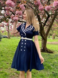 Nautical chic redefined with Retro Stage's Dark Blue 1950s Sailor Style Double Breasted Dress. Sail into style with a touch of vintage flair. Sailor Dress Women, Nautical Inspired Outfit, 50s Outfit, Vintage Outfits 70s, 1930s Fashion Women, Travel Attire, Vintage Dress Blue, Nautical Chic, 50s Women