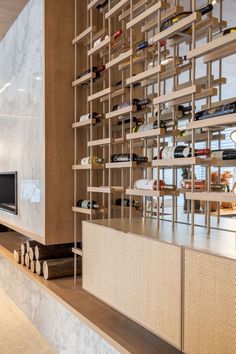 a living room filled with furniture and a flat screen tv sitting on top of a wooden shelf