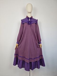 Vintage 80s bohemian smock dress. Featuring ruffle neckline, tired skirt, collar, two pockets and buttoned cuffs. Fastens with neck ties. The top tie can be removed if preferred. Purple and yellow mustard. Made from soft light fabric, slightly see through. Fabric: 65% polyester 35% cotton Brand: unknown Very good vintage condition / lightly used, few small pulls The modern size is recommendation only, please refer to measurements. Fits size UK 14 / L or smaller depending on desired fit (size 38 Fall Vintage Dress With Ruffles For Daywear, Fall Vintage Dress With Ruffles For Daytime, Retro Ruffled Dresses For Fall, Vintage Peasant Dress For Fall, Bohemian Dresses With Ruffles For Vintage Fashion, Vintage Fall Dresses With Ruffled Collar, 1970s Daywear Dresses With Ruffles, Vintage Ruffled Dress For Fall, Summer Victorian Dress With Ruffles And Long Sleeves