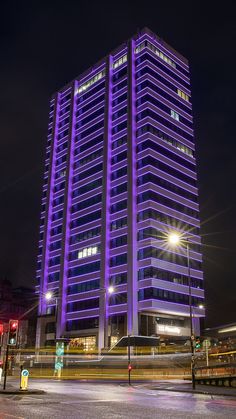 a very tall building lit up at night