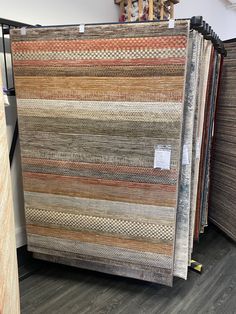 several rugs are on display in a store