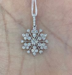 "Diamond Snowflake Pendant set with beautiful clear and sparkling diamonds. Excellent craftsmanship, lays nicely on the neck won't flip around. Give the gift of good luck with this pretty necklace. The diamonds are clean and of good quality; this is one she will treasure for a lifetime. Measures about 23mm length by 15mm width. Available 16\" strong 14K white gold link chain for purchase. Genuine Round Brilliant Cut Diamonds total weight: 1.06 carats Clarity: VS/SI Color: G 18K White gold Comes Diamond White Snowflake Jewelry For Formal Occasions, Sparkling Diamond Pendant Necklace, Formal Snowflake Diamond White Jewelry, Diamond White Snowflake Jewelry For Anniversary, Diamond White Cubic Zirconia Snowflake Jewelry, Fine Jewelry Sparkling White Diamond Necklace, Formal Diamond Snowflake Jewelry, Fine Jewelry White Sparkling Diamond Necklace, Fine Jewelry White Diamond Sparkling Necklace