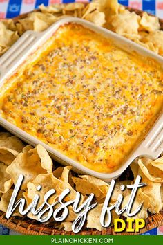 a casserole dish with cheese and tortilla chips on the side text reads, crispy fit dip