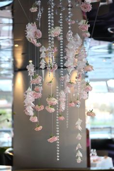 flowers hanging from the ceiling in a restaurant