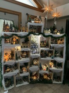 a room filled with lots of shelves covered in fake snow and christmas decorations on top of them