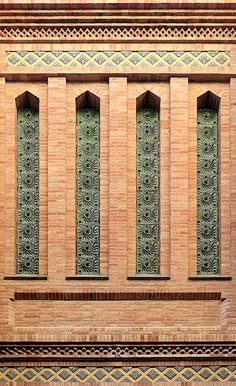 an image of a building that is made out of bricks and has decorative designs on it