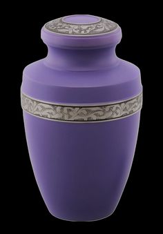 a large purple vase with silver trimmings on the top and bottom, sitting in front of a black background