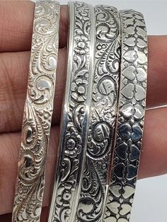 🌿⚘Gorgeousvintage 925 Sterling Silver Danecraft Bangles.  These patterns are quite rare and so is the heart motif one. The quality is outstanding as they are made by such a renowned company that is known for the highest quality and beautiful sterling Silver pieces. They are substantial bangles and have ornate deeply engraved curlicue patterns and floral themes. Perfect for stacking and creating a chic boho statement appeal. All are fully hallmarked and authentic pieces.  THEY ARE EACH HALLMARKED DANECRAFT STERLING. INNER CIRCUMFERENCE of 7.5 inches or diameter IS 2.5 INCHES. TOTAL WEIGHT 48.6 GRAMS. Excellent vintage condition and can be polished if desired. Please ask questions.  Thank you and do look at my other jewelry from vintage to antiques. Antique Jewelry Rare, Engraving Patterns, Bracelets Stack, Heart Motif, Floral Theme, Silver Pieces, Bracelet Stack, Sterling Silber, Antique Jewelry