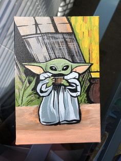 a painting of a baby yoda holding a coffee cup