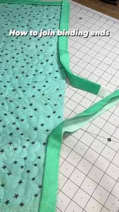 a piece of green fabric with black stars on it and the words how to join binding ends