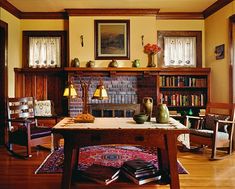 a living room filled with furniture and a fire place in the middle of a room