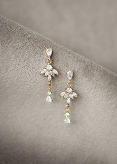 Effortless yet elevated, the Talia crystal earrings are a subtle yet dainty set to adorn sophisticated bridal looks. This is a set for brides who love sparkle without the bling factor. Elegant, refined and feminine, you will love to wear this set after your wedding day. * DETAILS * > Cubic zirconias, gold plated settings >  Measurement: 31mm length * READY TO SHIP * The Talia crystal earrings are ready to ship. Please allow 5-7 business days for processing plus delivery times. Please leave your Dainty Bridal Earrings, Gold Earring Set, Boho Bridal Earrings, Crystal Crown Wedding, Wedding Studs, Crystal Earrings Wedding, Crystal Bridal Earrings, Bridal Earrings Pearl, Vintage Style Wedding