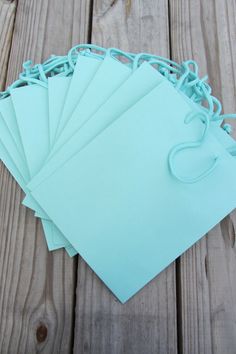 several pieces of light blue paper laid on top of each other