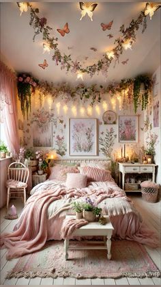 a bedroom decorated in pink and white with flowers on the ceiling