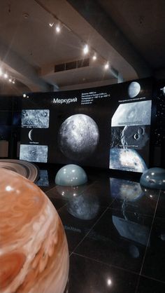 an image of planets on display in a museum