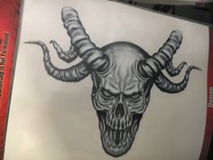 a drawing of a skull with horns on it