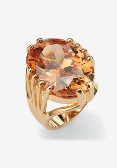 The brilliance of this cocktail ring is sure to dazzle. It's 24 carats of sparkling champagne-hued oval-cut cubic zirconia. Includes gift box and drawstring pouch. 14k gold-plated Main Stone: 1 Oval Faceted Cut Champagne Cubic Zirconia, 24.02 carats, 22 mm x 16 mmDimensions: 26 mm wide x 35 mm long x 12 mm highSizes 7-12Includes gift box and drawstring pouchImported  | Women's Yellow Gold-Plated Champagne Cubic Zirconia Cocktail Ring by PalmBeach Jewelry in Cubic Zirconia (Size 9) Drawstring Pouch, Champagne Color, Gold Plated Rings, Jewelry Online Shopping, Cocktail Ring, Cocktail Rings, Yellow Gold Rings, Oval Cut, Ring Designs