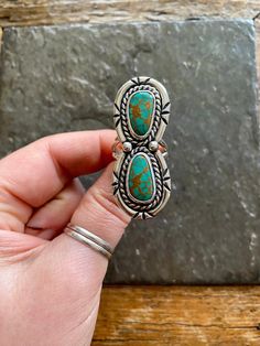 Handmade Tyrone Turquoise and sterling silver statement ring.  -Ring will fit US size 7.5 Vintage American Southwest style design. Beautiful teal-green color with unique warm brown matrix.  Hand polished, rustic looking patina and stamped shadowbox like border.  Hand stamped Indian style Arrow and Rising Sun hallmark on backside. Chunky, double split style ring shank/band.   Turquoise stones are sourced from the Tyrone turquoise mine in New Mexico.   100% Sterling silver. --------------------- E Teal Green Color, Ring Shank, Ladies Ring, American Southwest, Statement Ring Silver, Southwest Style, Paper Jewelry, Turquoise Stones, Turquoise Rings