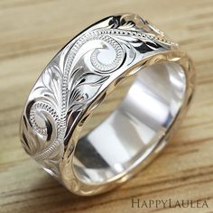 a wedding ring with an intricate design on it