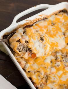 a casserole dish filled with meat and cheese