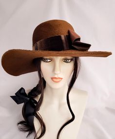 "ONE OF A KIND" Hand blocked mousseline millinery felt hat in fabulous boho style! Dramatic warm brown color and a texture that is so luscious and soft. It has a longer nap than most velour felts.  Oval crown with a bit of a bowler shape to it. Decorated with stunning vintage velvet ribbon that was Made in France. Lovely 4" sweeping brim.   Head size is 22"-22.5" Ships FREE UPS ground. This is a 25.00 savings! Hat Fedora, Couture Hats, Boho Hat, Vintage Velvet, Felt Hat, Velvet Ribbon, Winter Hat, Brown Color, Fedora