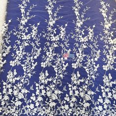 white flowers and leaves on blue sheer lace fabric, sold by the yard or yard