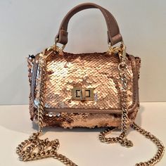 Rose Gold Steve Madden Sequined Shoulder Bag. Twist Gold Tone Feont Close. Removable Gold Tone Shoulder Strap. Interior Lining With One Zip Pocket. Measurements (Approx): 5" ( 7" With Handle; 29" With Strap) X 7" X 3" Nwt - Never Used - Excellent Condition. No Tears, Stains, Holes, Or Discoloration. Party Satchel With Mobile Phone Bag, Party Mobile Phone Satchel Bag, Gold Evening Satchel With Mobile Phone Bag, Luxury Party Satchel, Gold Satchel With Detachable Strap For Party, Gold Top Handle Satchel For Party, Gold Party Satchel With Detachable Strap, Gold Party Satchel, Party Crossbody Satchel With Chain Strap