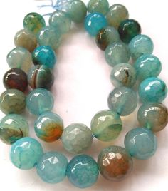 material:natural stone quantity:one strand 16inch=65-32pcs size:approx.6 8 10 12mm note:have larger stock and offert wholesale price. Round Faceted Agate Beads, Faceted Agate Beads, Round 8mm Agate Beads, Brass Pendants, Earrings Stone, Blue Onyx, Worry Stones, Onyx Bead, Crystal Gifts