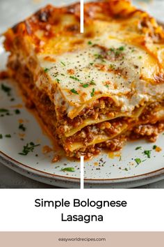 a white plate topped with lasagna covered in sauce and cheese, along with the words simple bolognaese lasagna