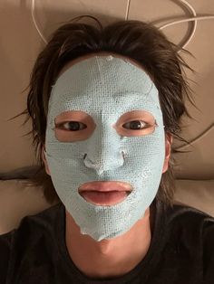 a person with a sheet mask on their face