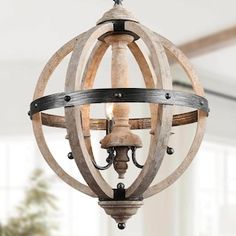 an orb chandelier hanging from the ceiling