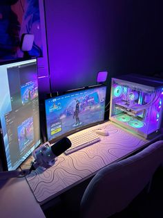 two computer monitors sitting next to each other on top of a desk in front of a purple wall