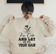 42.00 USD Hair Stylist Sweatshirts Hoodies Crewneck Hooded For Women Cosmetology Plus Size Hoodie Shirts Beautician Hairstylist Gifts for Her Introducing our Hair Stylist Sweatshirt - the perfect addition to any cosmetologist or hairstylist's wardrobe! This comfortable and stylish sweatshirt features a fun and playful message on the back that reads "Keep Calm and Let Me Cut Your Hair." Crafted with high-quality materials, this sweatshirt is not only stylish but also comfortable to wear. The… Hair Message, Hairstylist Gifts, Handyman Shirt, Esthetician Marketing, Plus Size Hoodie, Funny Gifts For Him, Cozy Fabric, Cosmetology, Boys Shirts