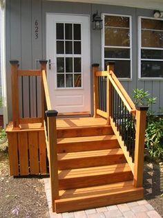 a porch with steps leading up to the front door