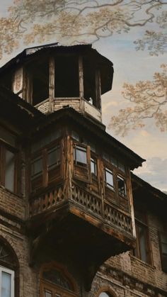 an old building with wooden balconies and windows