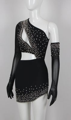 a mannequin wearing a black dress with silver studdings on it's shoulders