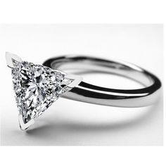 a white gold ring with a princess cut diamond