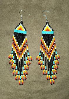 These beautifully crafted earrings are amazing for anyone and everyone with its beautiful length and beautiful colors. Multicolor Southwestern Style Drop Earrings, Southwestern Multicolor Drop Earrings, Southwestern Multicolor Teardrop Earrings, Southwestern Style Multicolor Drop Earrings, Mountain Earrings, Crafted Earrings, Handmade Earrings Beaded, Fire Mountain, Earrings Beaded