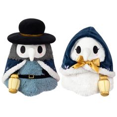 two stuffed animals wearing hats and scarves