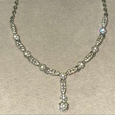 Swarovski Petal Link Necklace / Like New / Chain Is Silver Color / Circle And Oval Crystal Studded Links W/ Silver Pebbled Details. Elegant Debutant Necklace That Sparkles Chain Length: 15.5” Toggle: 3” #Swarovski #Swarovskicrystal #Swarovskicrystals #Loveswarovski #Swarovskinecklace #Swarovskinecklaces #Gift #Present #Jewelry #Silver #Debutant #Sparkly Formal Crystal Embellished Cubic Zirconia Necklace, Elegant Silver Necklaces With Stones, Elegant Sterling Silver Rhinestone Necklace For Formal Occasions, Elegant Crystal Embellished Necklaces For Anniversary, Elegant Diamond Studded Necklace For Formal Occasions, Elegant Silver Diamond Necklace With Stones, Elegant White Gold Necklace With Rhinestones, Dazzling Crystal Embellished Formal Necklaces, Luxury Sparkling Necklace For Formal Occasions