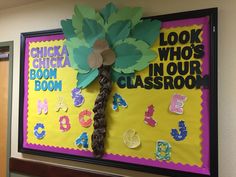 a bulletin board with flowers and numbers on it