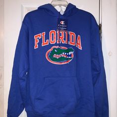 Florida Gators Primetime Stadium Hoodie Smoke Free Closet Size: Medium. Color: Royal Blue. 50/50 Cotton, Polyester Blend. Approximate Measurements While Laying Flat. Armpit To Armpit: 21” Shoulder To Bottom Hem(Length): 23” Sleeves: 23” Florida And The Gators Logo Are On The Front. Please Let Me Know If You Have Any Questions. Thanks For Checking Out The Collection! Florida Gators Hoodie, Gator Logo, Orange Hoodie, College Hoodies, Hoodie Fits, University Of Florida, Florida Gators, Blue Hoodie, Pullover Men