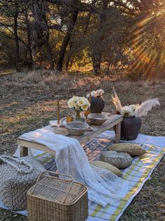 a picnic table set up in the middle of a field