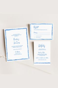 wedding stationery with blue ink on white paper