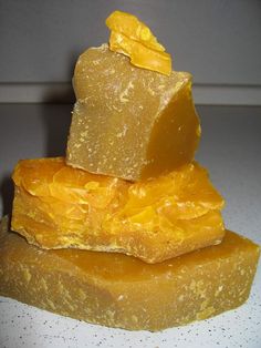 three pieces of yellow soap stacked on top of each other