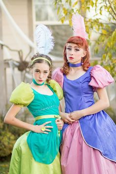 two women dressed in costume standing next to each other