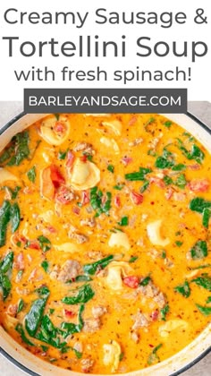 creamy sausage and tortellini soup with fresh spinach in a skillet on the stove