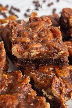 chocolate pecan bars stacked on top of each other